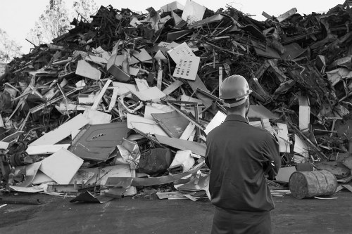 Construction site with builders waste being cleared in Camberley